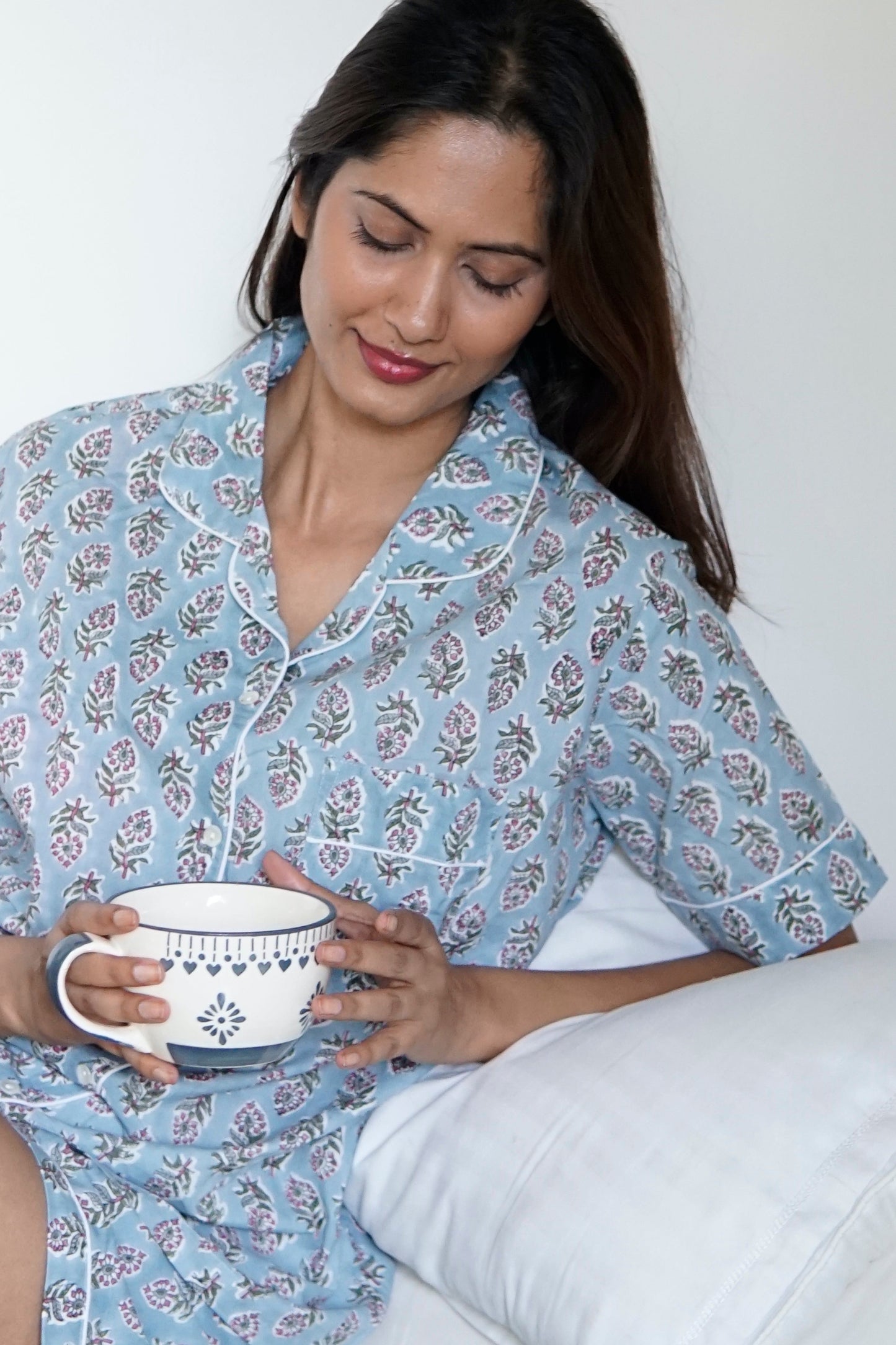 cotton pyjamas for women. sleepwear, pyjamas, airforce blue and white floral print cotton women’s pyjamas, contrast piping, short sleeved top and pyjama shorts. cotton, weekend wear, rest and relaxation, loungewear, bridesmaid attire, Hospital wear, summer apparel, cotton pyjamas