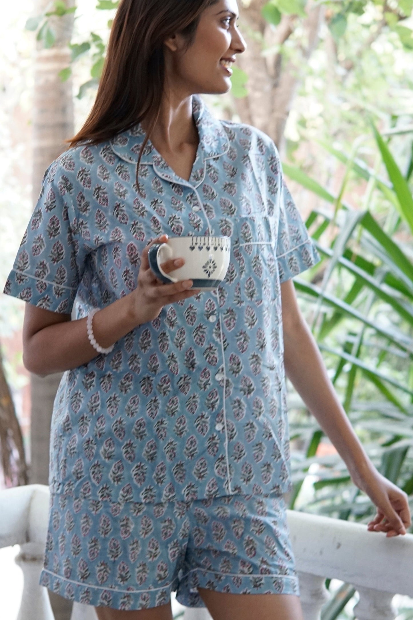 cotton pyjamas for women. sleepwear, pyjamas, airforce blue and white floral print cotton women’s pyjamas, contrast piping, short sleeved top and pyjama shorts. cotton, weekend wear, rest and relaxation, loungewear, bridesmaid attire, Hospital wear, summer apparel, cotton pyjamas