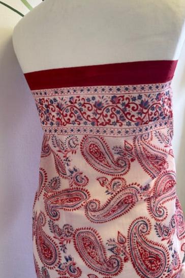 A striking red and white block printed sarong. Measuring 1m 80 x 1m, this handmade sarong features a vibrant block printed motif and makes a stunning cover up on the beach. It does so much more however and is a 'must pack' summer piece. I never go away to the sun without at least three! They are simply so versatile, making wonderful wrap skirts, scarves, tops, beach dresses and head wraps. In short, this beautiful sarong is a real multi-tasker and you can go super chic or super cool in how you style