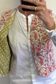reversible cotton quilted gilet, padded waistcoat, pink and white floral print and coordinating print inside. pockets